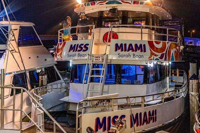 Miami: Adults Only Party Cruise with Two Drinks Included - Downtown Miami lit up after dark